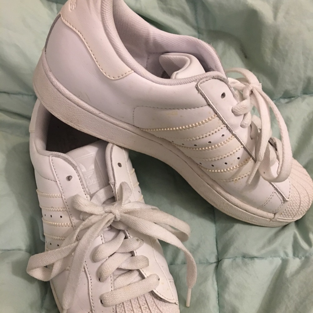 White adidas shell tops unisex.